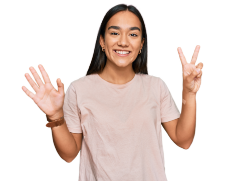 Young asian woman wearing casual clothes showing and pointing up with fingers number seven while smiling confident and happy.