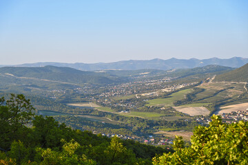 Fototapeta na wymiar Evening hilly landscape of the Abrau-Durso village