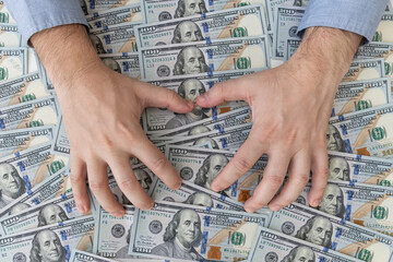 Success, motivation, financial flows, wealth. Stack of dollars,dollars in hand. money background....