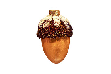 Toy acorns hang as decoration on a green Christmas tree, close-up, isolated on a white background