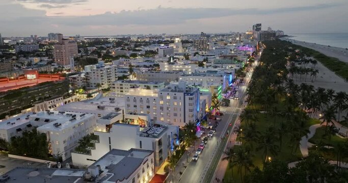 Drone view of Ocean Drive at Night Miami. Night Miami aerial view. Art deco district at night with neon light, South Beach, Miami Florida. Drone view. Ocean Drive in Miami at night street. Nightlife.