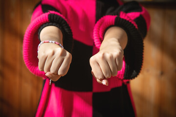 Angry caucasian woman with threatening fist.