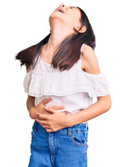 Beautiful child girl wearing casual clothes with hand on stomach because nausea, painful disease...