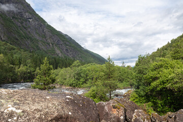 Fototapeta na wymiar Hiking path to the waterfalls in Kinsarvik, norway