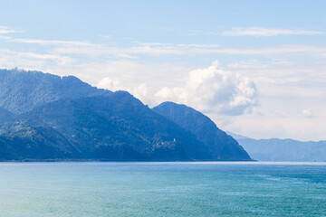 Fototapeta premium travel to Georgia - view of mountain coast of Black Sea in Turkey from Sapri village, Georgia on sunny autumn day