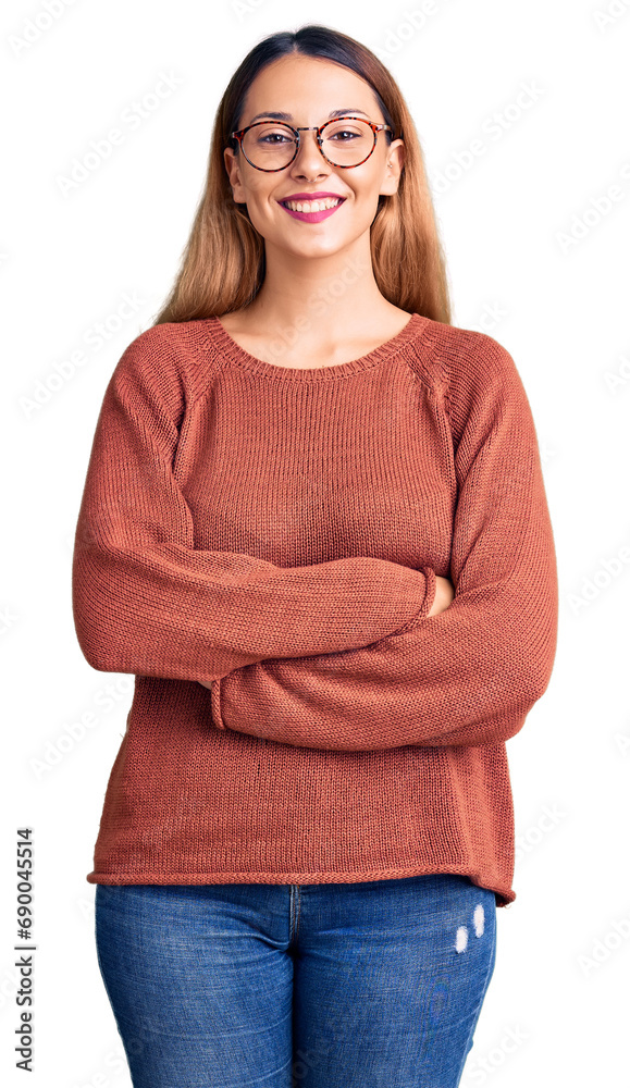 Wall mural Beautiful young woman wearing casual clothes and glasses happy face smiling with crossed arms looking at the camera. positive person.