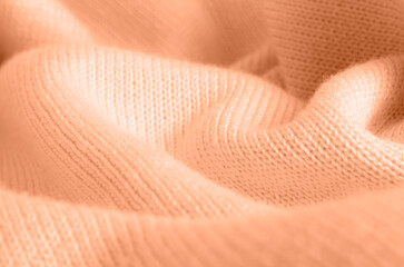 Knitted pink canvas, soft focus. Color peach fuzz