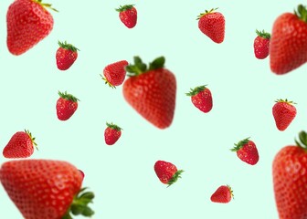 Red strawberries, Creative composition with floating levitating ripe strawberries on a pastel background. healthy food concept. Minimal fruit idea. strawberries flying in the air. Copy space.