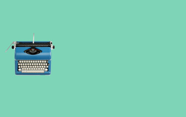 Typewriter machine in retro style on green background. Top view