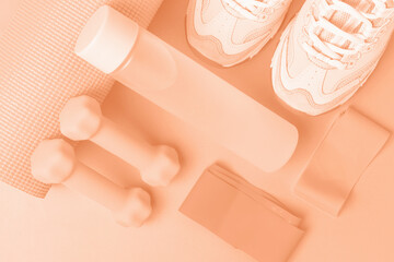 Sneakers and sports accessories trending color of year 2024 Peach Fuzz. - obrazy, fototapety, plakaty