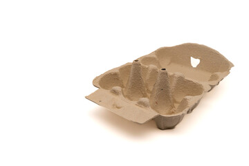 Wide open empty egg box for six eggs, isolated on white with copy space. Carton pack, egg-container for packaging.