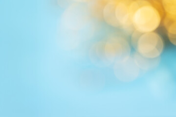 Beautiful, soft-focus bokeh effect with a gradient from a light blue to a golden hue.