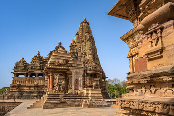 Naklejka premium The Khajuraho Group of Monuments are a group of Hindu and Jain temples Khajuraho Temple, popular worldwide for its outstanding temples designs and erotic sculpture. It is a UNESCO world Heritage site.