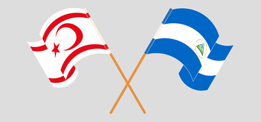 Crossed and waving flags of Northern Cyprus and Nicaragua