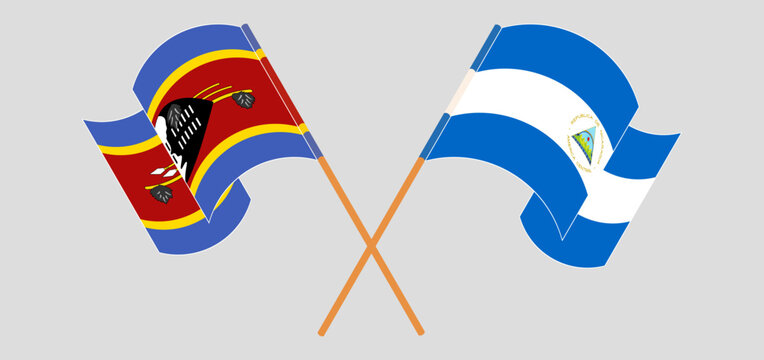 Crossed and waving flags of Eswatini and Nicaragua