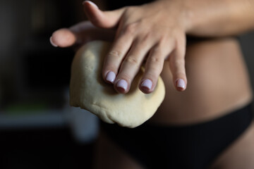  Girl rolling out dough in the kitchen