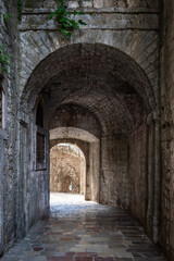 Fototapeta na wymiar View of the city fortress arch and the street Kotor, Montenegro. The Bay of Kotor is the beautiful place on the Adriatic Sea. Kotor, Montenegro.