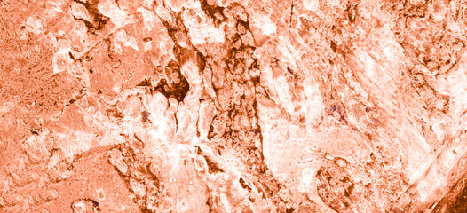 Abstract texture background. Peach fuzz color and white spots. Different shades. Brown is almost black in places. Chaotic uneven texture. Moments of blur.