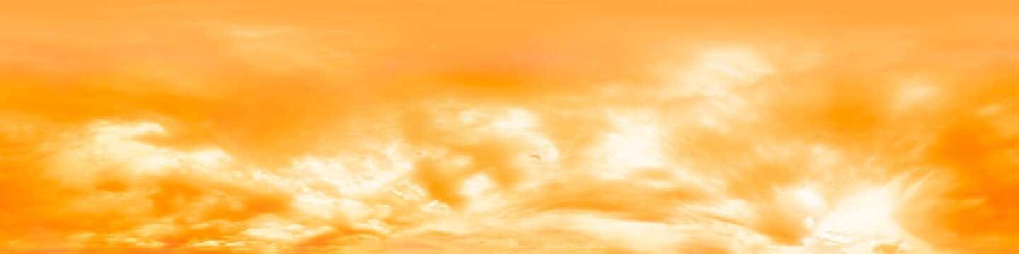 Dramatic overcast sky panorama with glowing golden orange clouds. HDR 360 seamless spherical panorama. Sky dome in 3D, sky replacement for aerial drone panoramas. Climate and weather change concept