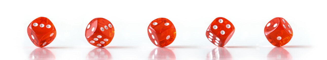 Set of dice resting in a corner on reflective table