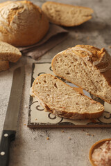 A loaf of rye bread in low key