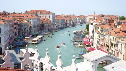 Grand canal of Venice with boats, gondolas and picturesque houses seen from Fondaco dei Tedeschi rooftop
