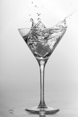 Splash in martini glass, alcohol, frozen motion