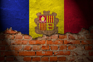 A wall with a painting of the andorra flag at night. - obrazy, fototapety, plakaty
