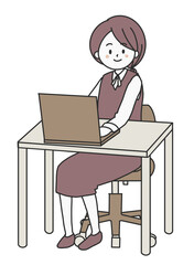 パソコンを操作しながら正面を向く女性