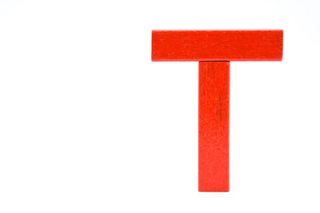 Red wooden building block, standing with crossbar isolated on a white background