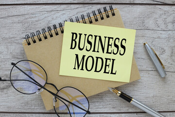 business model. note paper with text. text