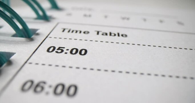 Paper diary organizer with time closeup 4k movie. Meeting scheduling closeup