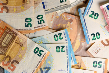 euro bills scattered on the table as a background 5 - obrazy, fototapety, plakaty
