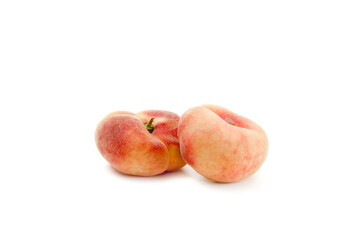 Two saturn peaches or flat peaches isolated on white background with clipping path..