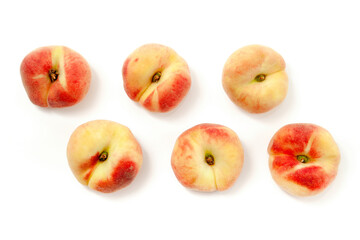 Several saturn peaches or flat peaches isolated on white background with clipping path..