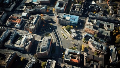 Fototapeta premium Aerial view of a bustling urban area with roads, buildings, and greenery during daylight hours in a modern city