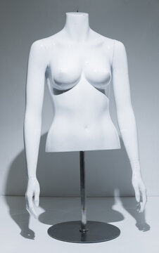 A Female Mannequin Torso With adjustable arms Arms, gloss White Chest . Bust Display on metal pole and base. Fashion model for retail stores to show off clothing. Retail displays.