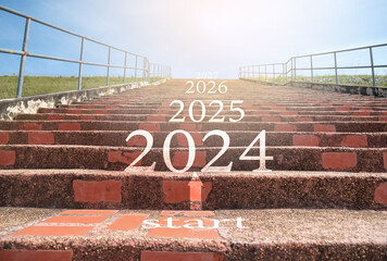 2024 2025 2026 on the upward staircase and the concept of starting in the new year. - obrazy, fototapety, plakaty