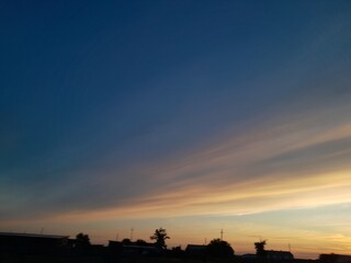 beautiful panorama of vilage in silhouettes and colourful sky in sunset. High quality photo