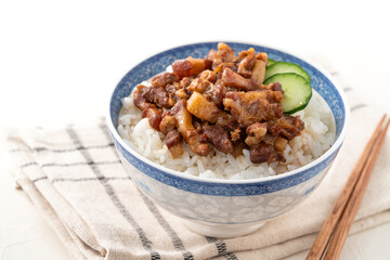Braised pork belly meat over cooked rice, famous and delicious street food in Taiwanese restaurant.