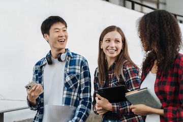 Education knowledge and university concept - group of students reading and preparing for exams on holiday.