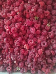Fresh and sweet raspberries background. High quality photo