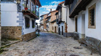 Street and traditional houses of the beautiful town of Candelario, in Salamanca.