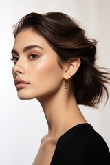Fototapeta premium Beautiful model girl in a plain white studio, softly light. Suitable for diverse commercial projects
