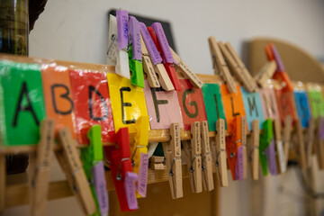 clothespins and coloured letters in a kindergarden