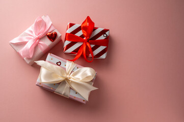 Obraz na płótnie Canvas Gift boxes with satin bows, birthday, Mother's Day or Valentine's Day background