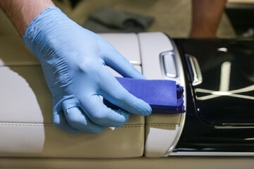 The process of applying a protective ceramic composition to the leather interior of the car...