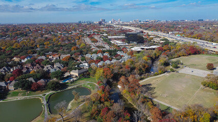 Colorful fall foliage at Park Central with luxury lakeside residential houses, soccer fields, White...