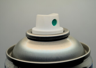 White plastic cap on a metal can close up