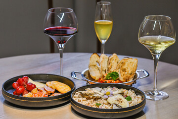 Gourmet wine pairing with fine dining appetizers. Culinary elegance and taste.